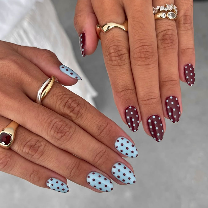 Polka-dot nails, blue and burgundy french tips, inverted on other hand