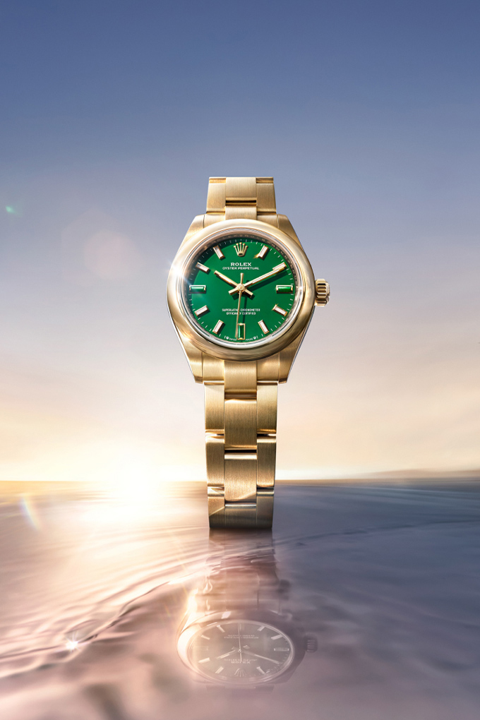 Image of Rolex Perpetual 28 watch with green dial floating in the sky